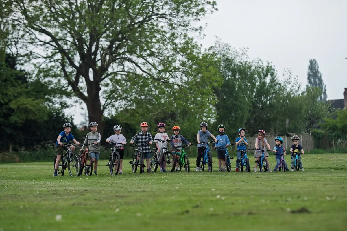 Children lined up with their bikes